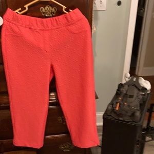 Pink capries The have flower print in same color.